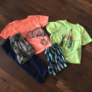 A bundle of two sets of boy toddler pajamas.