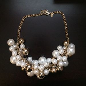 Gold and pearl choker-style bauble necklace.