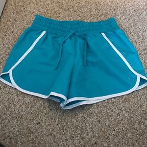 Turquoise running shorts, size medium