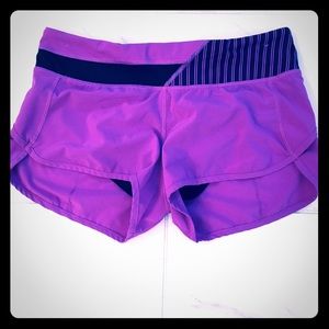 Lululemon size 4 fuschia and black shorts