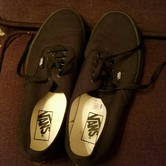 Solid black Vans