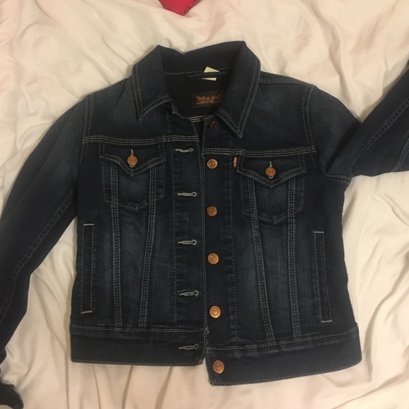 A dark blue jean jacket( made by LEVI'S)