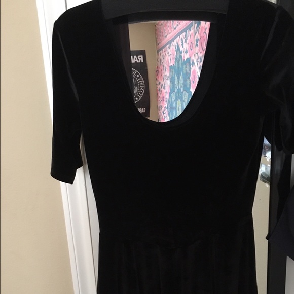 Black velvet skater dress with open back
