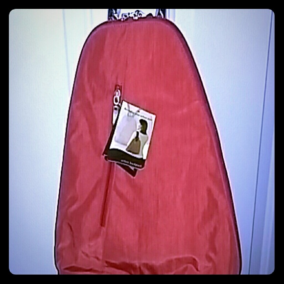 Baggallini orange urban backpack.