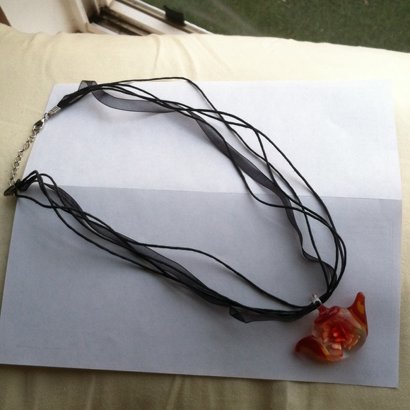 Teacup necklace.