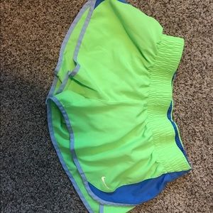 Green and blue Nike running shorts