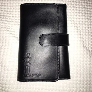 Sketch book with colored pencils in leather case.