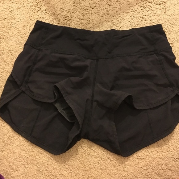 SIZE 2 LULULEMON SHORTS. WORN TWICE. LOOKS NEW.