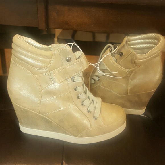Gold sneaker wedges.