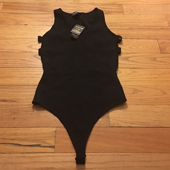 Bebe Tops - Bebe revealing back and side bodysuit.