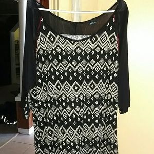 Tribal print baseball top with red details.