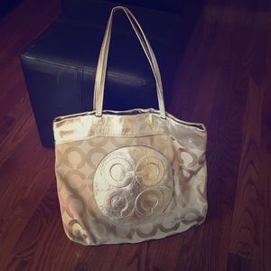 Gold coach bag