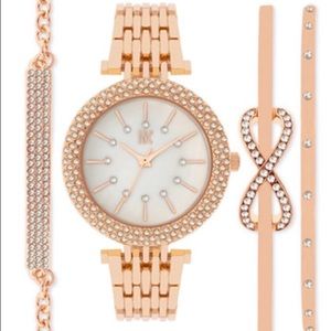 INC rose gold tone watch with matching bracelets