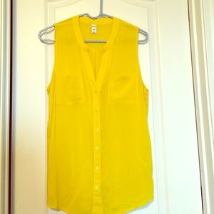 Bright yellow, sleeveless, button-front blouse