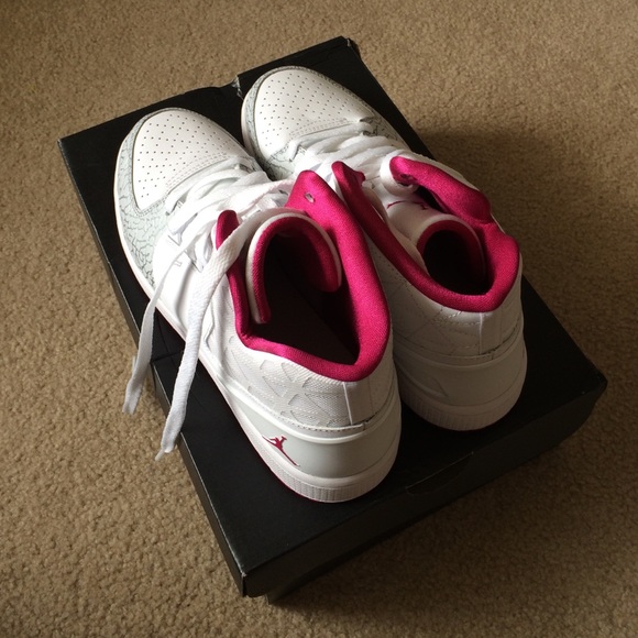 Fuchsia pink, white and grey Jordans.