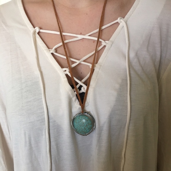 Handmade wire-wrapped turquoise pendant on tan - Picture 1 of 2