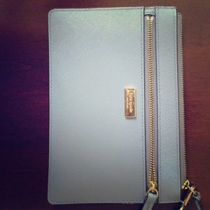 Purple Kate Spade wristlet.
