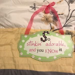 Two hanging pieces of art