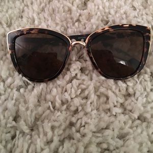 Tortoise shell and gold sunglasses