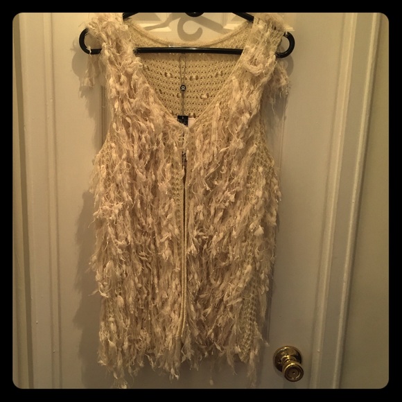 Fun and trendy shag vest. Size S/M. NEVER WORN!