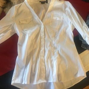 white shirt, fitted at waist