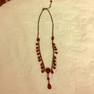 Dark metal reddish/maroon beaded necklace.