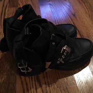 Black heel with silver buckles