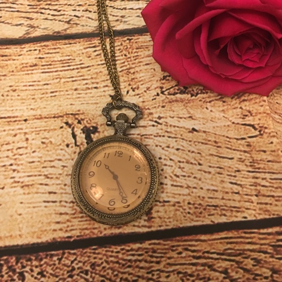 Antiqued pocket watch necklace.