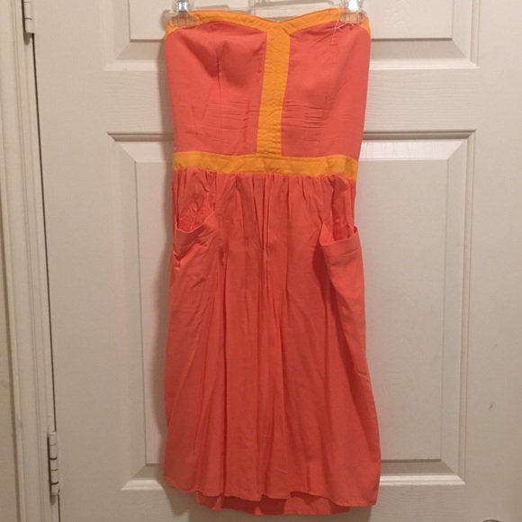 Tangerine strapless dress.