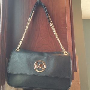 Michael Kors purse. Used. Still has some life left