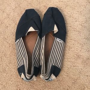 Navy blue and white-striped Toms