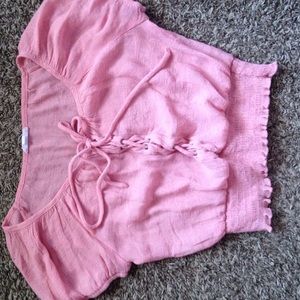 pink peasant-style crop top