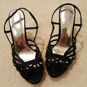 ** Black strappy heels