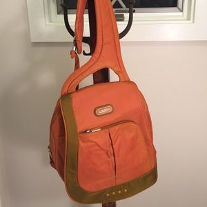 Orange Tumi crossbody bag