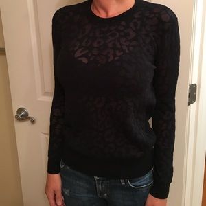 Theory black partially sheer sweater.