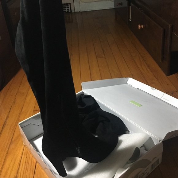 Thigh high black boots from Shi by Journeys.