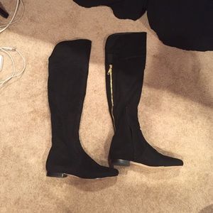 Tall black suede boots