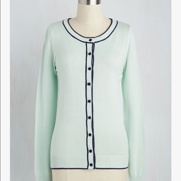 Sea foam pastel cardigan with navy trim.