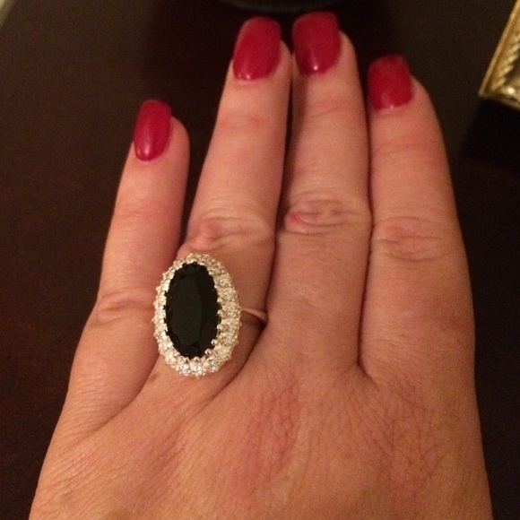 Silver ring with black stone and Cz diamonds.