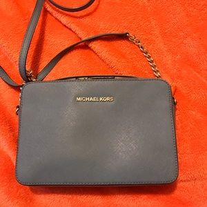 Light blue Michael Kors cross body purse