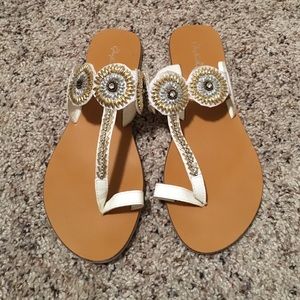 White sandals with single toe strap