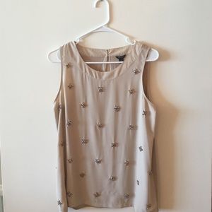 Embellished sleeveless top. Chiffon material.