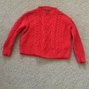 Red Polo cable-knit sweater.