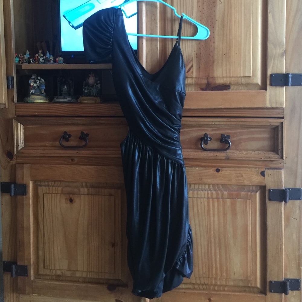 Beautiful like new bebe unique dress. Very sexy on - Picture 4 of 4