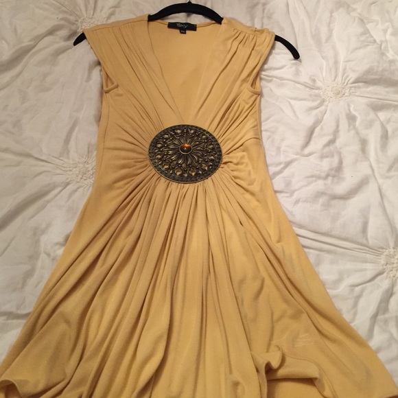 Yellow top with medallion in the middle