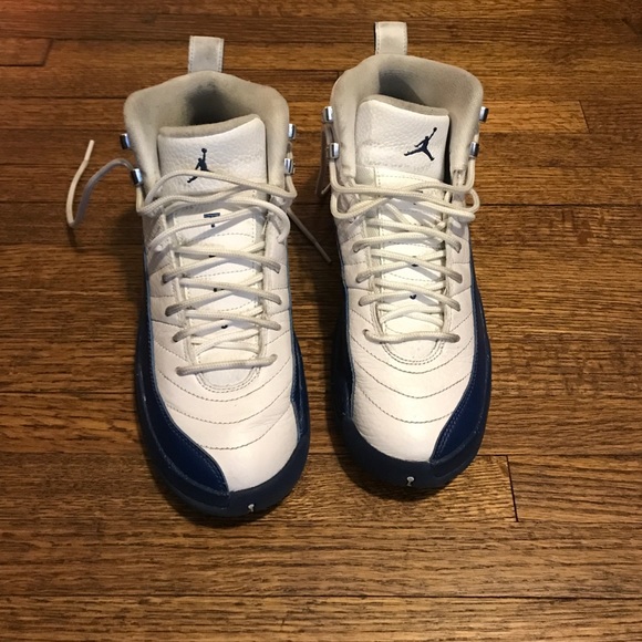 Royal blue and white Jordan 12's