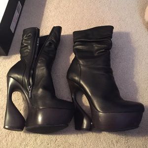 Black booties with unique heel