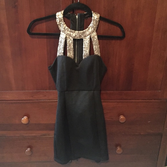 Black mini dress with gold sequin neck