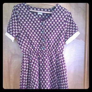 Red dress with raccoon pattern