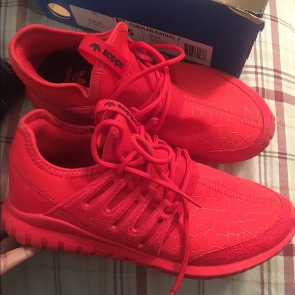 All red Addidas tubular .